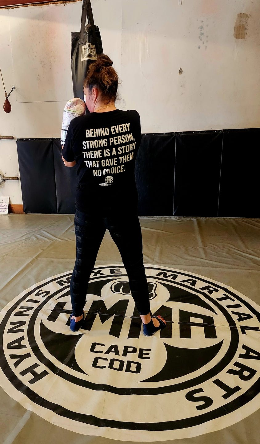 Behind Every Strong Person — Tee - Raise The Standard Apparel